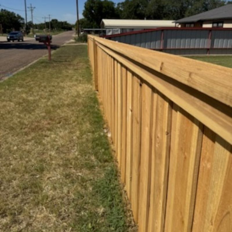 Board on Board fence installed by Top Rail Fence