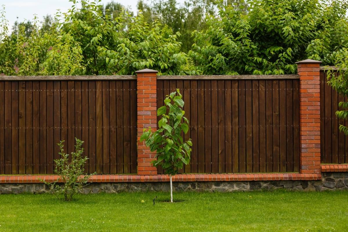 Wood and brick privacy fence