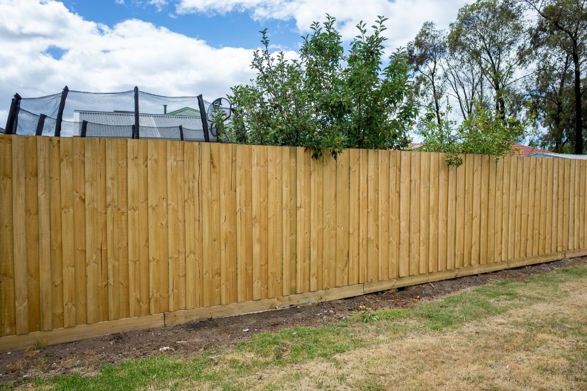 Newly installed backyard wood fence for a residential home.