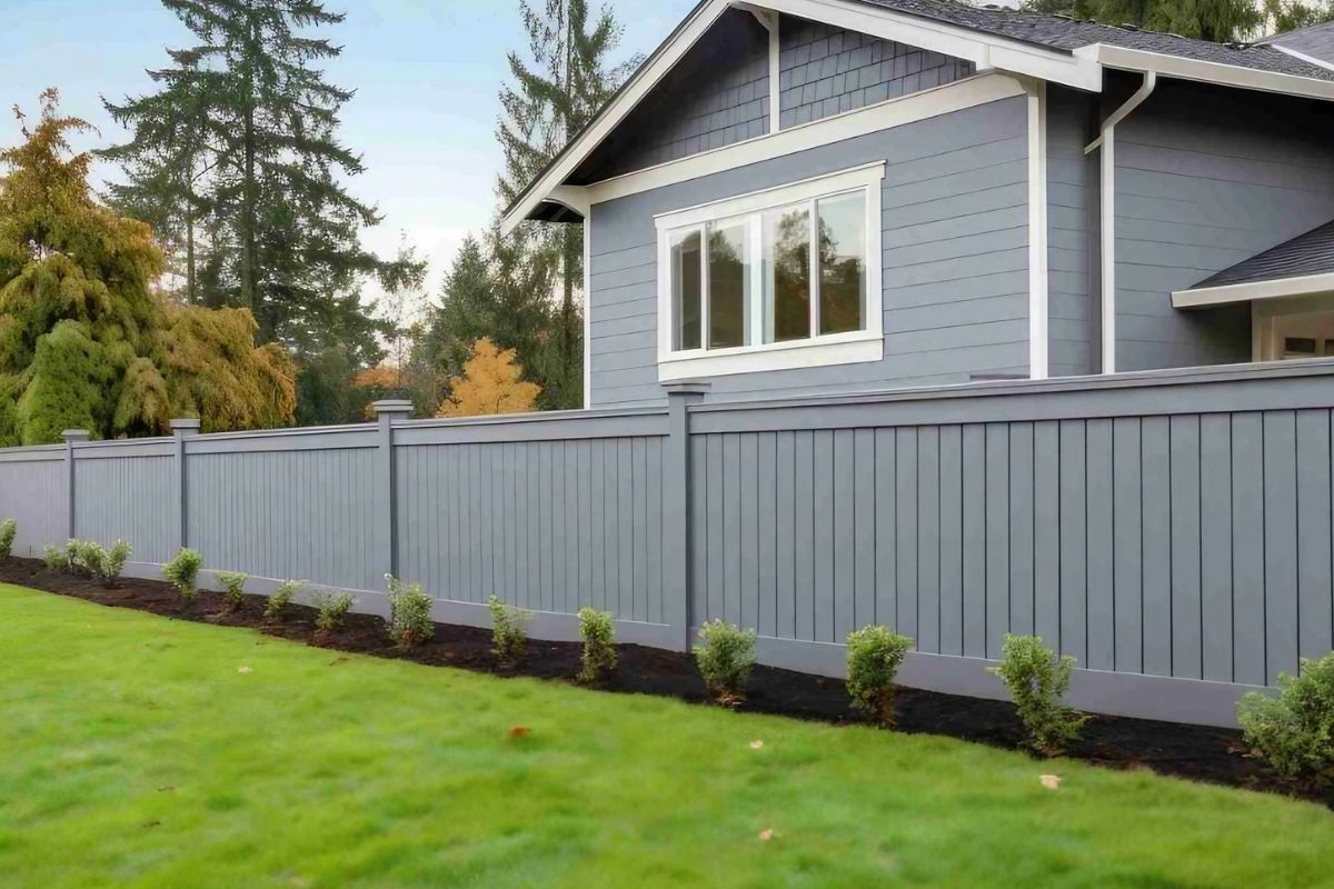 Light blue privacy fence and a matching blue house