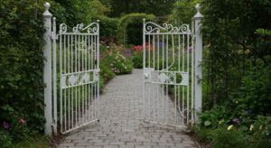 white wrought iron gate to garden