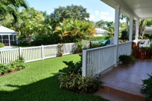 Backyard with white picket fence and porch in Florida