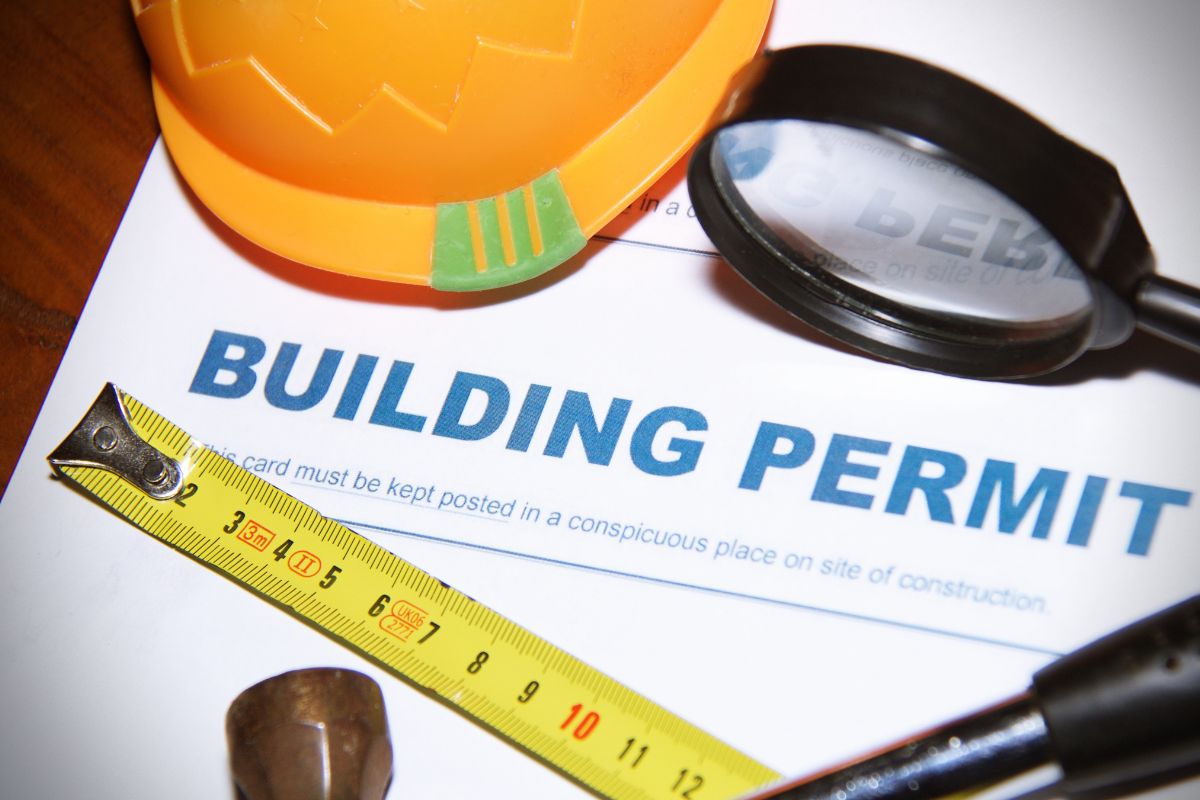 Building Permit with contstruction tools around it