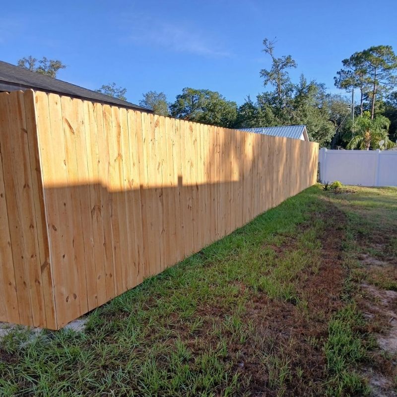 wood stockade fence installed by Top Rail Fence