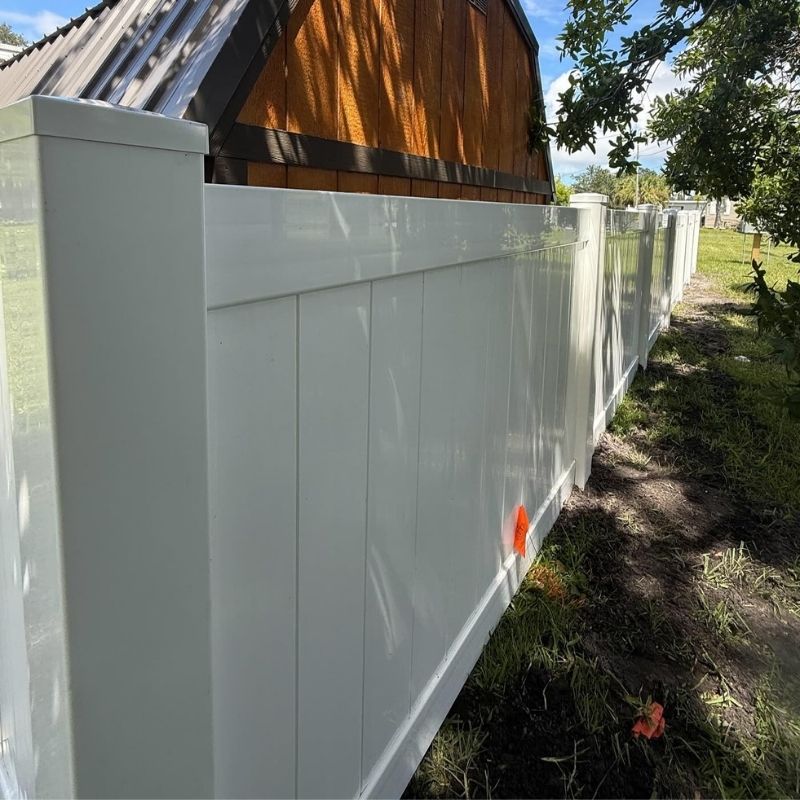 vinyl fence installed by top rail fence