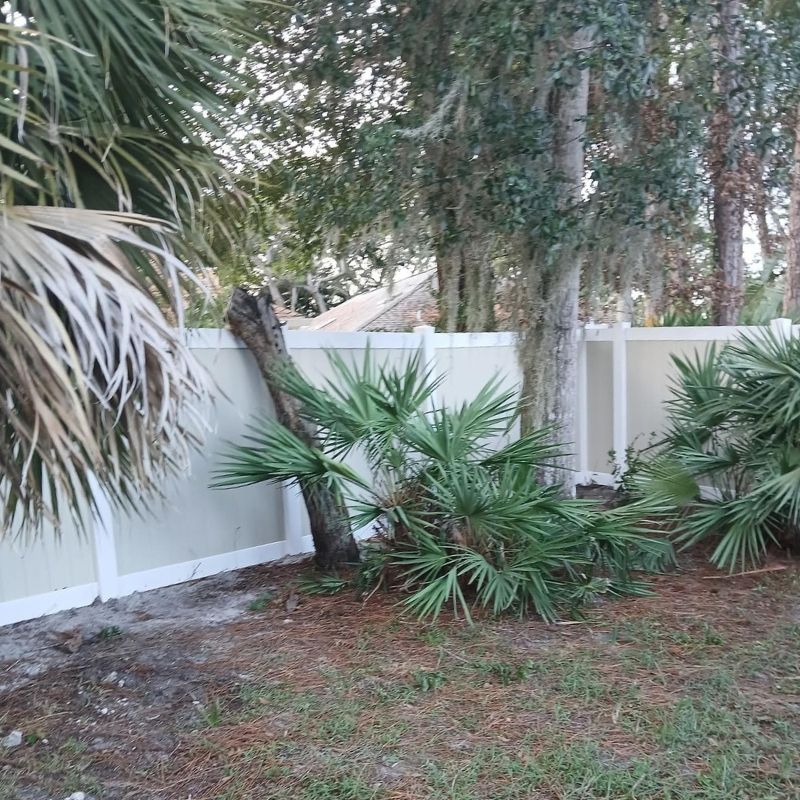 Two tone vinyl fence installed by Top Rail Fence
