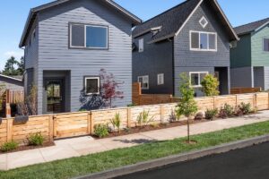 horizontal wood fencing in front of new housing