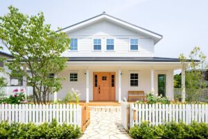 White home with matching white picket fence