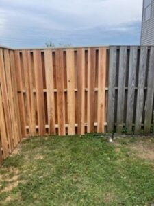 New and old fence panels constructed together