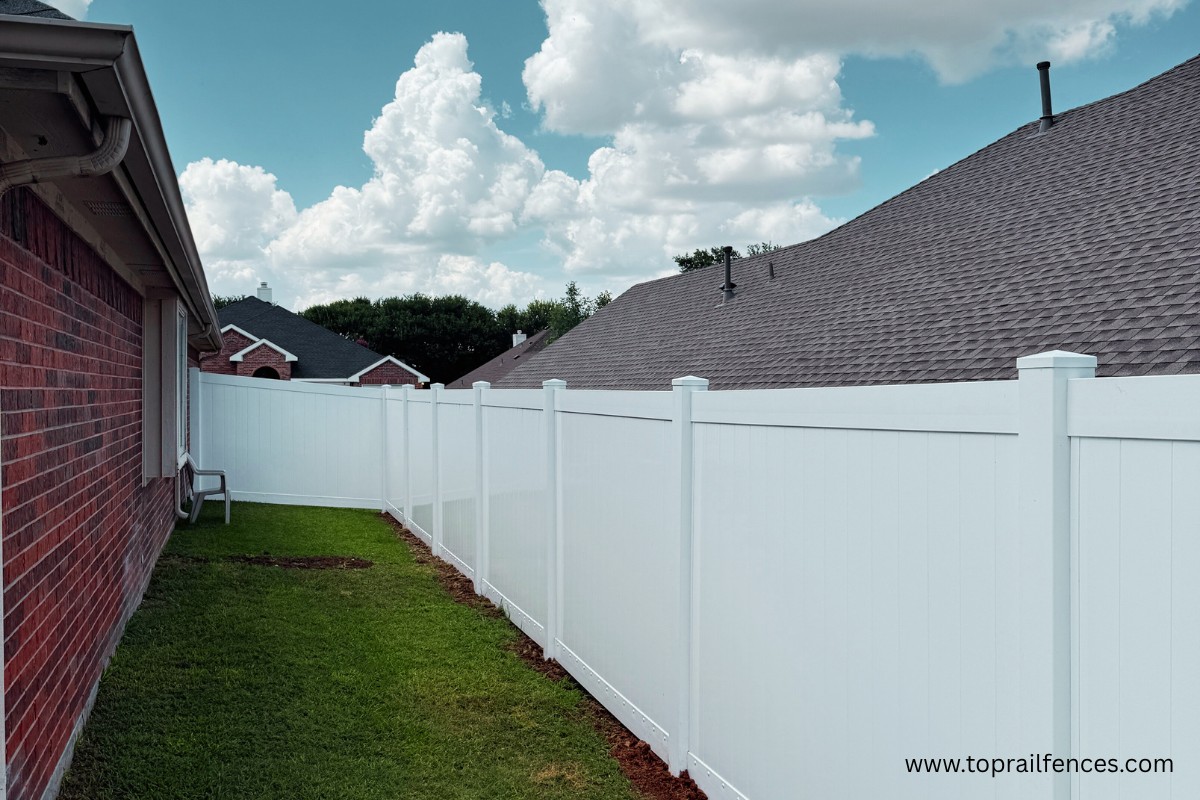white vinyl fence installed by Top Rail Fence