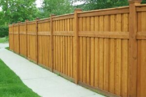 wood cap and trim fence in neighborhood